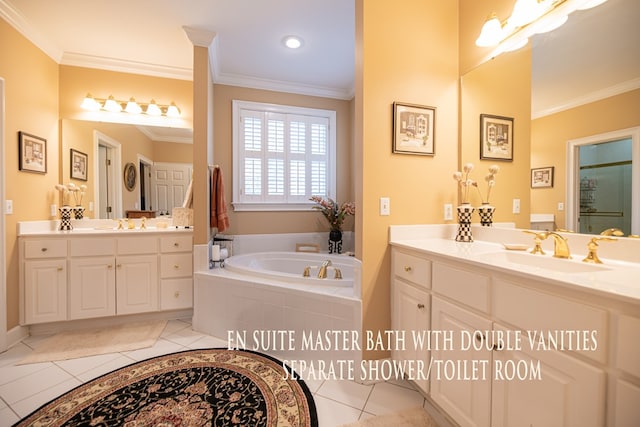 bathroom with crown molding, tile patterned flooring, a sink, and a bath