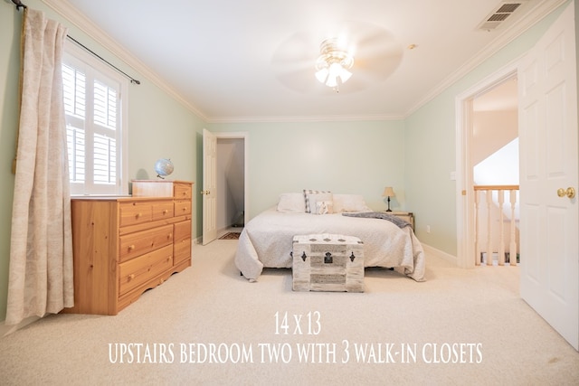 bedroom with baseboards, carpet, visible vents, and crown molding