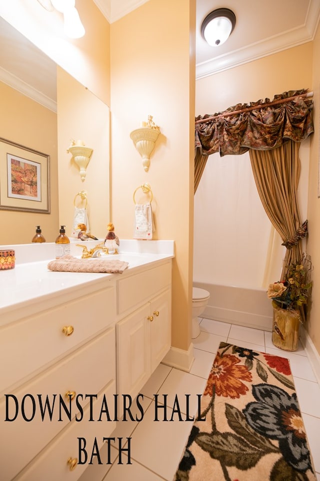 full bathroom featuring toilet, tile patterned flooring, ornamental molding, and vanity