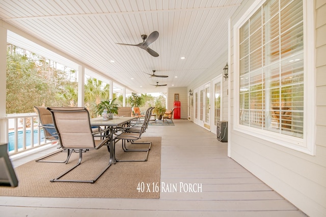 sunroom with a ceiling fan