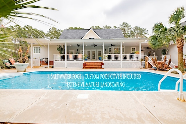 outdoor pool featuring french doors, a patio area, ceiling fan, and stairway