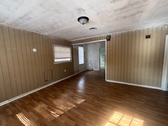 unfurnished room featuring dark hardwood / wood-style flooring