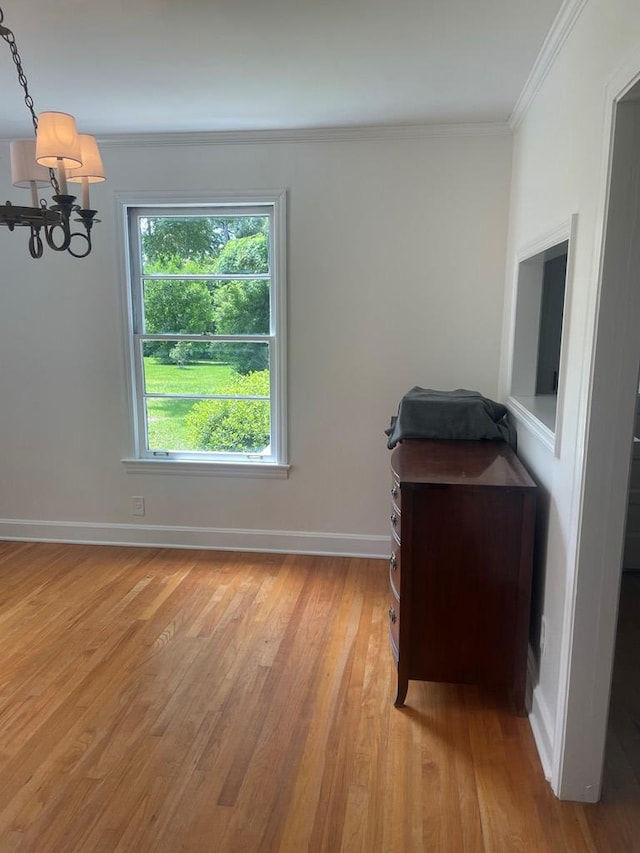 1202 Tallahassee Hwy, Bainbridge, GA 39819 - unfurnished office featuring a chandelier, crown molding, light wood-type flooring, and baseboards