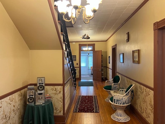 40 SW 5th Ave, Cairo, GA 39828 - foyer entrance with a chandelier, wood-type flooring, wainscoting, and crown molding