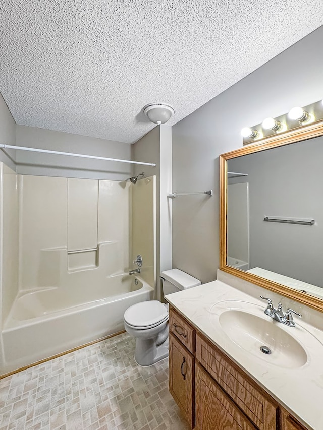 full bathroom featuring shower / bathtub combination, a textured ceiling, toilet, and vanity