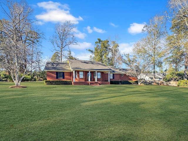 ranch-style house featuring a front lawn