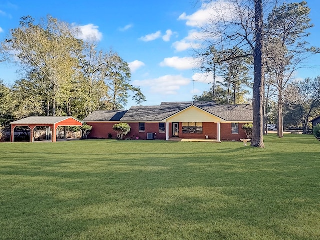 exterior space with a front yard and a carport