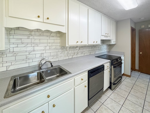 kitchen with sink, white cabinets, light tile patterned floors, a textured ceiling, and stainless steel appliances