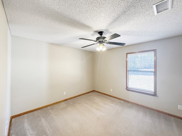 empty room with light carpet and ceiling fan