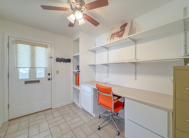 home office featuring a ceiling fan and built in desk