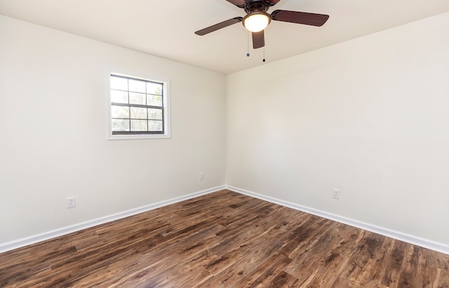 unfurnished room with dark hardwood / wood-style floors and ceiling fan