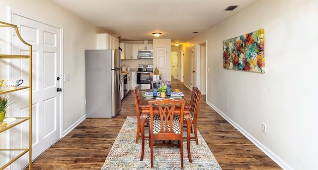 dining room featuring dark hardwood / wood-style floors