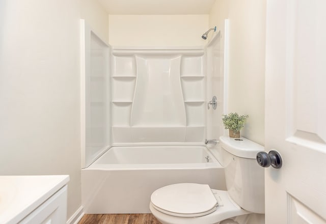 full bathroom featuring toilet, vanity, tub / shower combination, and hardwood / wood-style flooring