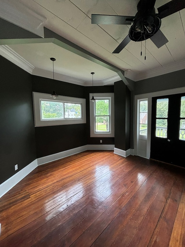 spare room with crown molding and hardwood / wood-style floors