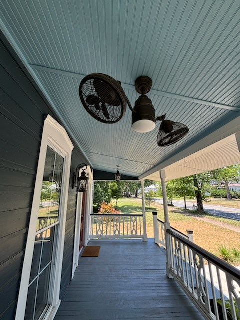 wooden terrace featuring a porch