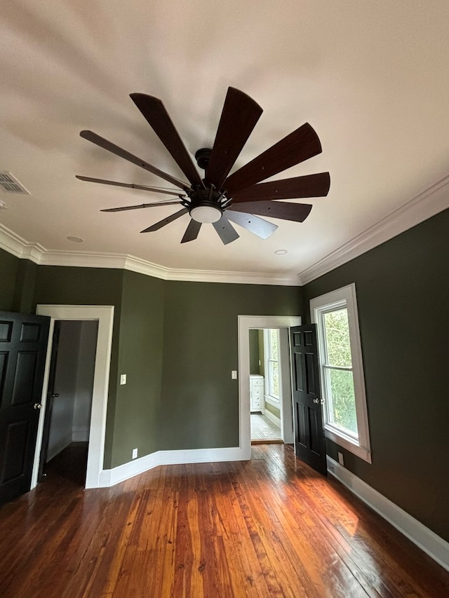 spare room with ceiling fan, hardwood / wood-style floors, and ornamental molding