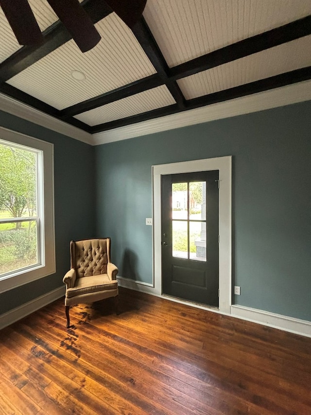 sitting room featuring beamed ceiling, ceiling fan, wood-type flooring, and coffered ceiling