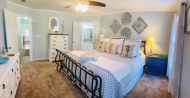 carpeted bedroom featuring ensuite bath, ceiling fan, and crown molding