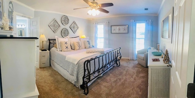 bedroom featuring ceiling fan, crown molding, and carpet