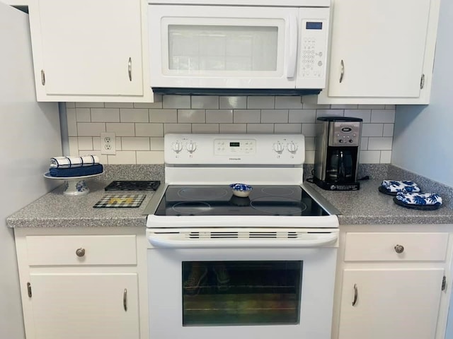 kitchen with white cabinets, white appliances, and backsplash