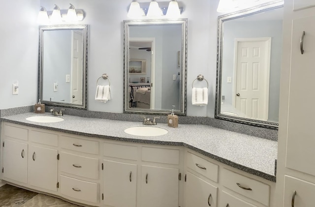 bathroom featuring vanity and ceiling fan