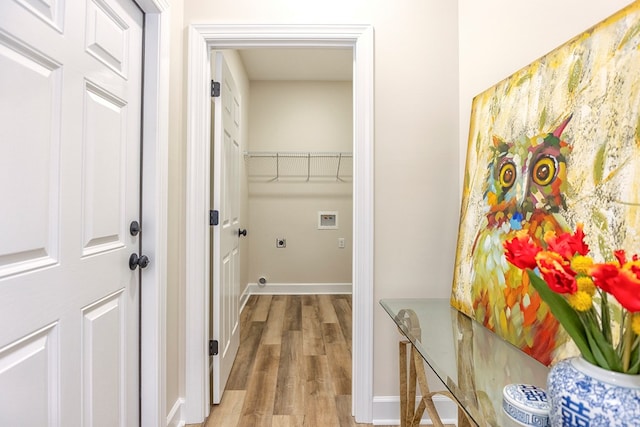 laundry room featuring hookup for an electric dryer, hardwood / wood-style floors, and hookup for a washing machine