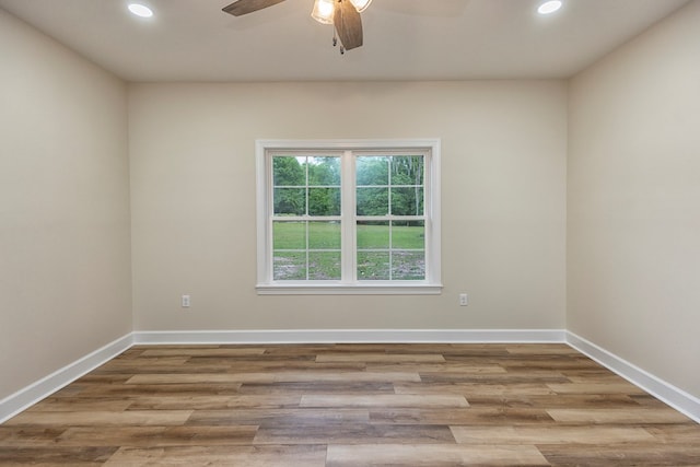 spare room with ceiling fan and light hardwood / wood-style floors