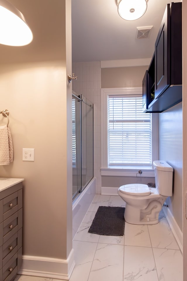 full bathroom featuring baseboards, visible vents, combined bath / shower with glass door, toilet, and marble finish floor