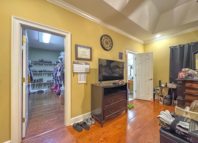 living room featuring crown molding and light wood-type flooring