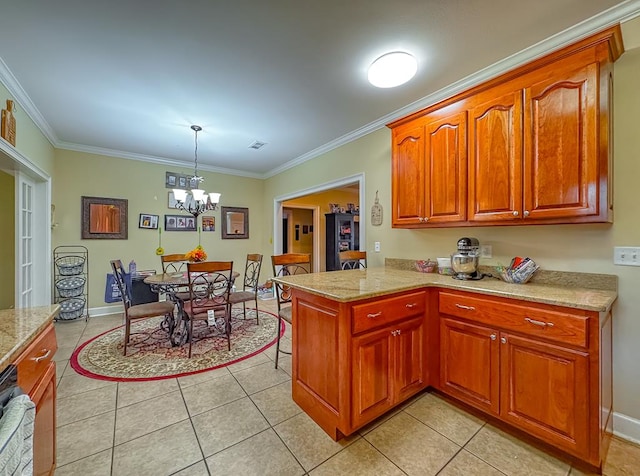 kitchen featuring light tile patterned floors, decorative light fixtures, ornamental molding, and kitchen peninsula