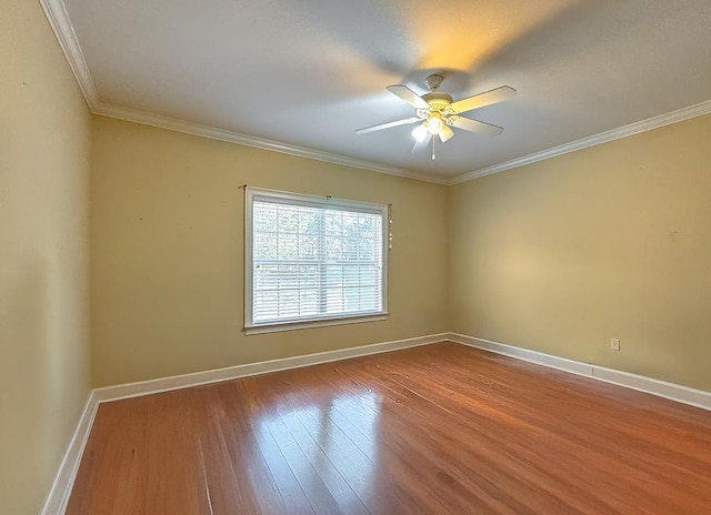 empty room featuring ornamental molding, hardwood / wood-style floors, and ceiling fan