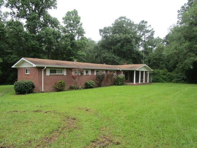 ranch-style home with a front lawn