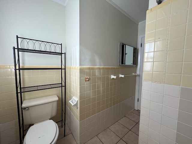 bathroom featuring tile walls, crown molding, and tile patterned floors