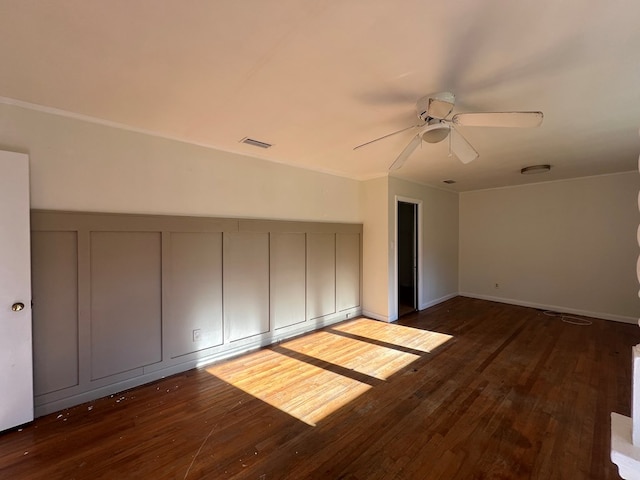 interior space featuring ceiling fan, a closet, and dark hardwood / wood-style floors