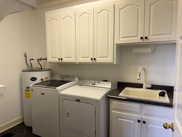 742 Booster Club Rd, Bainbridge, GA 39819 - laundry room featuring water heater, independent washer and dryer, cabinet space, and dark tile patterned flooring