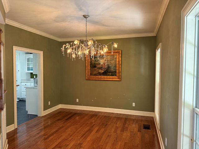 742 Booster Club Rd, Bainbridge, GA 39819 - unfurnished room with dark wood-style flooring, ornamental molding, and a chandelier