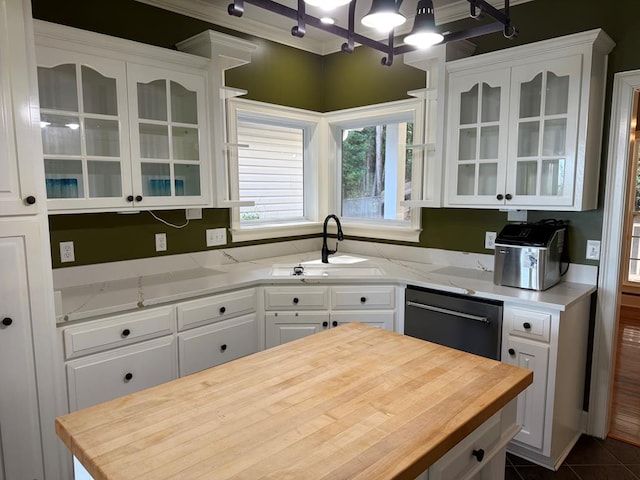 742 Booster Club Rd, Bainbridge, GA 39819 - kitchen with butcher block counters, white cabinetry, dishwasher, glass insert cabinets, and crown molding