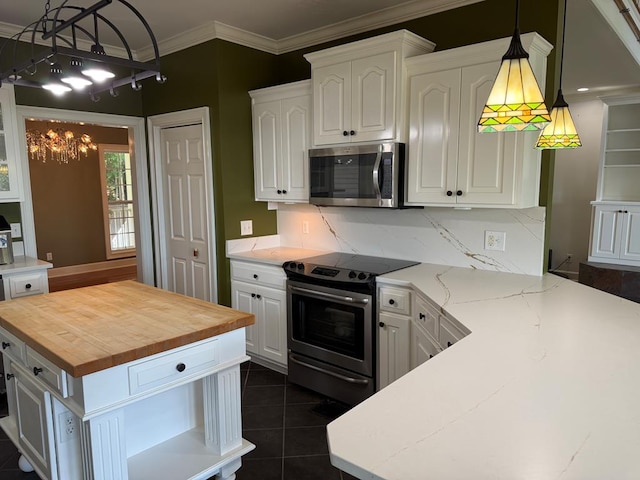 742 Booster Club Rd, Bainbridge, GA 39819 - kitchen featuring appliances with stainless steel finishes, wood counters, a chandelier, white cabinets, and decorative backsplash