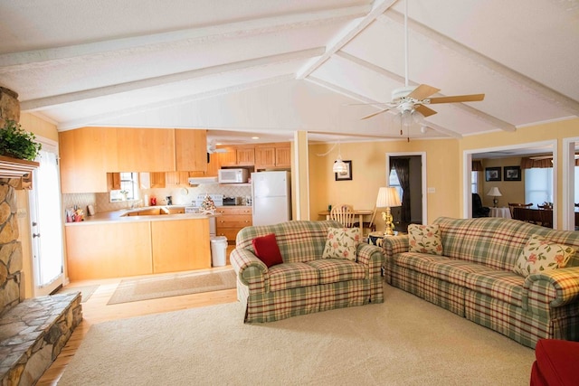 living room with lofted ceiling with beams and ceiling fan