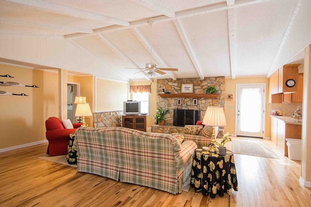 living room with light hardwood / wood-style flooring, a fireplace, lofted ceiling with beams, and ceiling fan