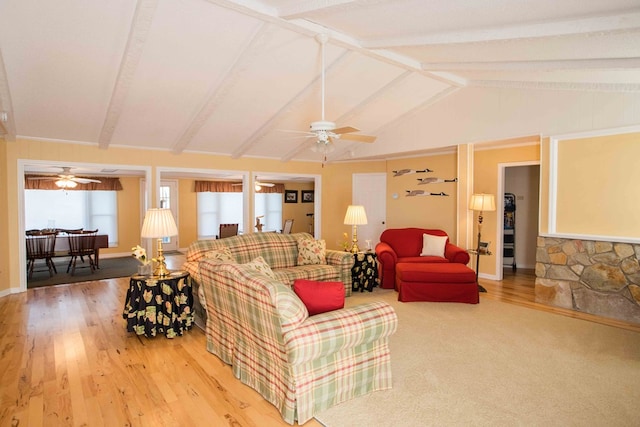 living room with lofted ceiling with beams, hardwood / wood-style flooring, and ceiling fan