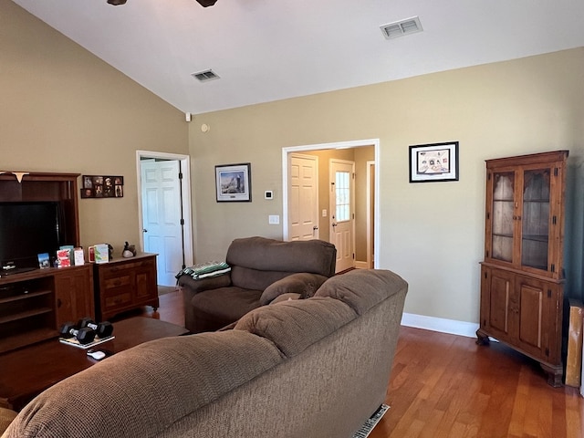 living room featuring lofted ceiling, ceiling fan, and dark hardwood / wood-style floors