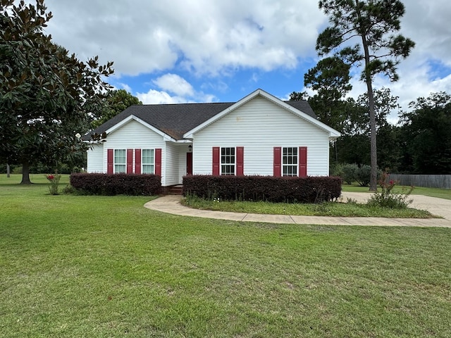 ranch-style home with a front lawn