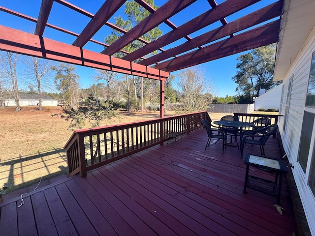 wooden deck featuring a pergola and a yard