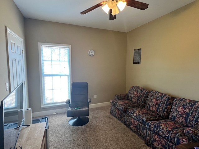 carpeted living room with plenty of natural light and ceiling fan