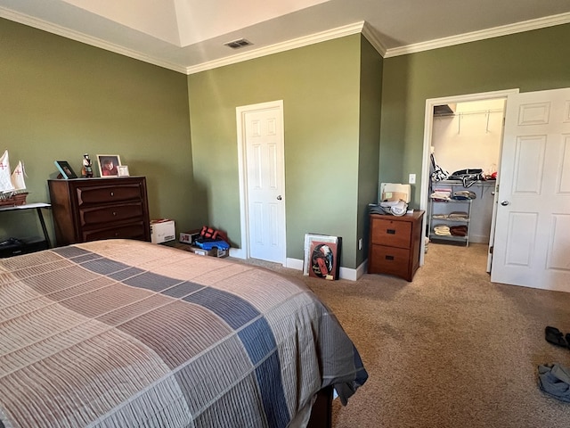 bedroom with carpet, a closet, and crown molding