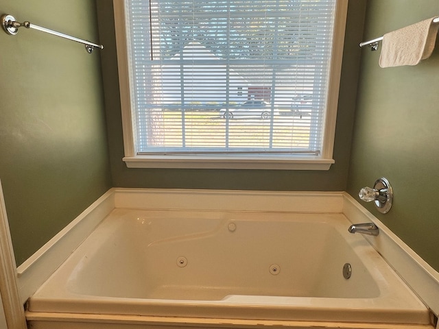 bathroom with a tub to relax in