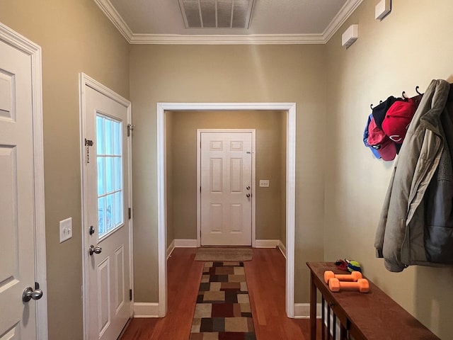 doorway to outside with dark hardwood / wood-style flooring and ornamental molding