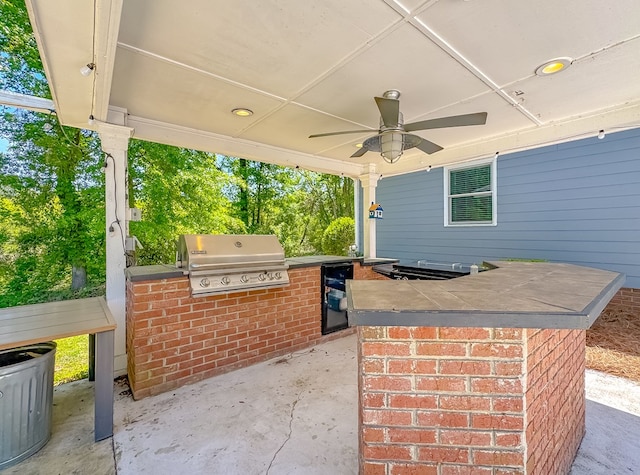 2107 Hughes St, Bainbridge, GA 39819 - view of patio featuring exterior kitchen, a grill, and ceiling fan