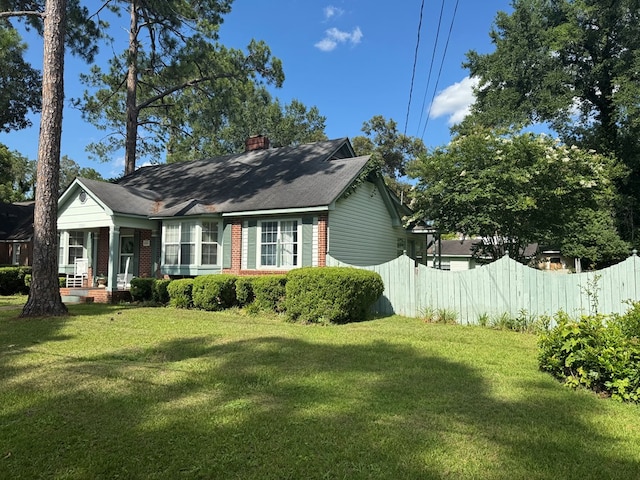 1001 Hall St, Bainbridge, GA 39819 - view of side of home with brick siding and a chimney